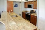 Kitchen With Granite Counter Tops, Custom Cabinets, & Stainless Steel Appliances